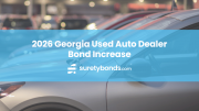 Background image of silver car with blue horiznotal stirpe and text that reads: 2026 Georgia Used Auto Dealer Bond Increase